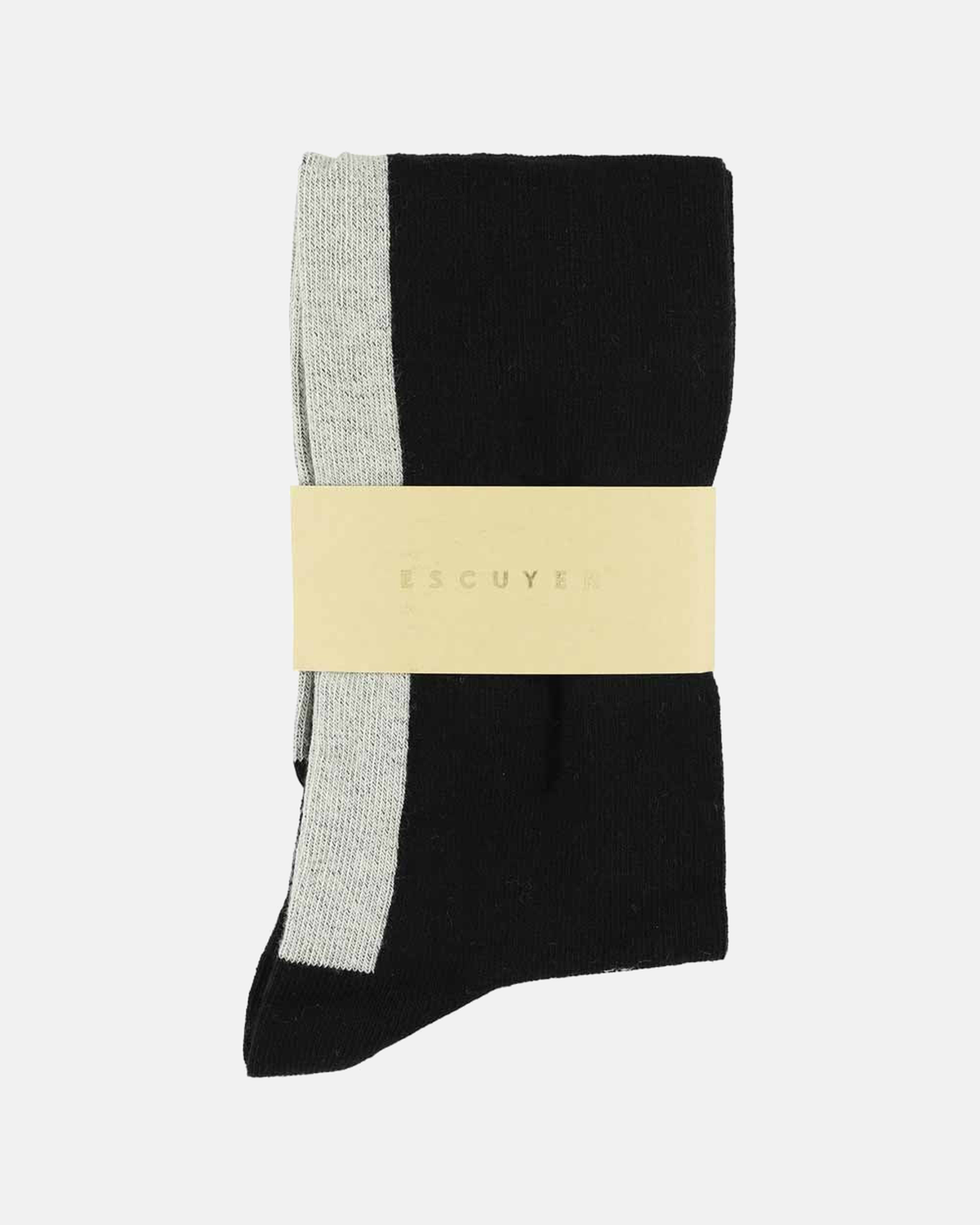 Escuyer black and ecru socks folded with brand band on a light grey background