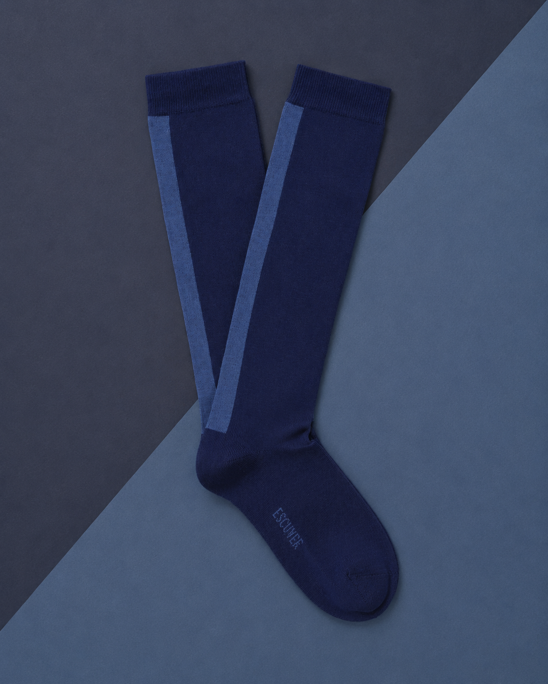 Escuyer women's knee high socks in blue and light blue on a two-tone blue background