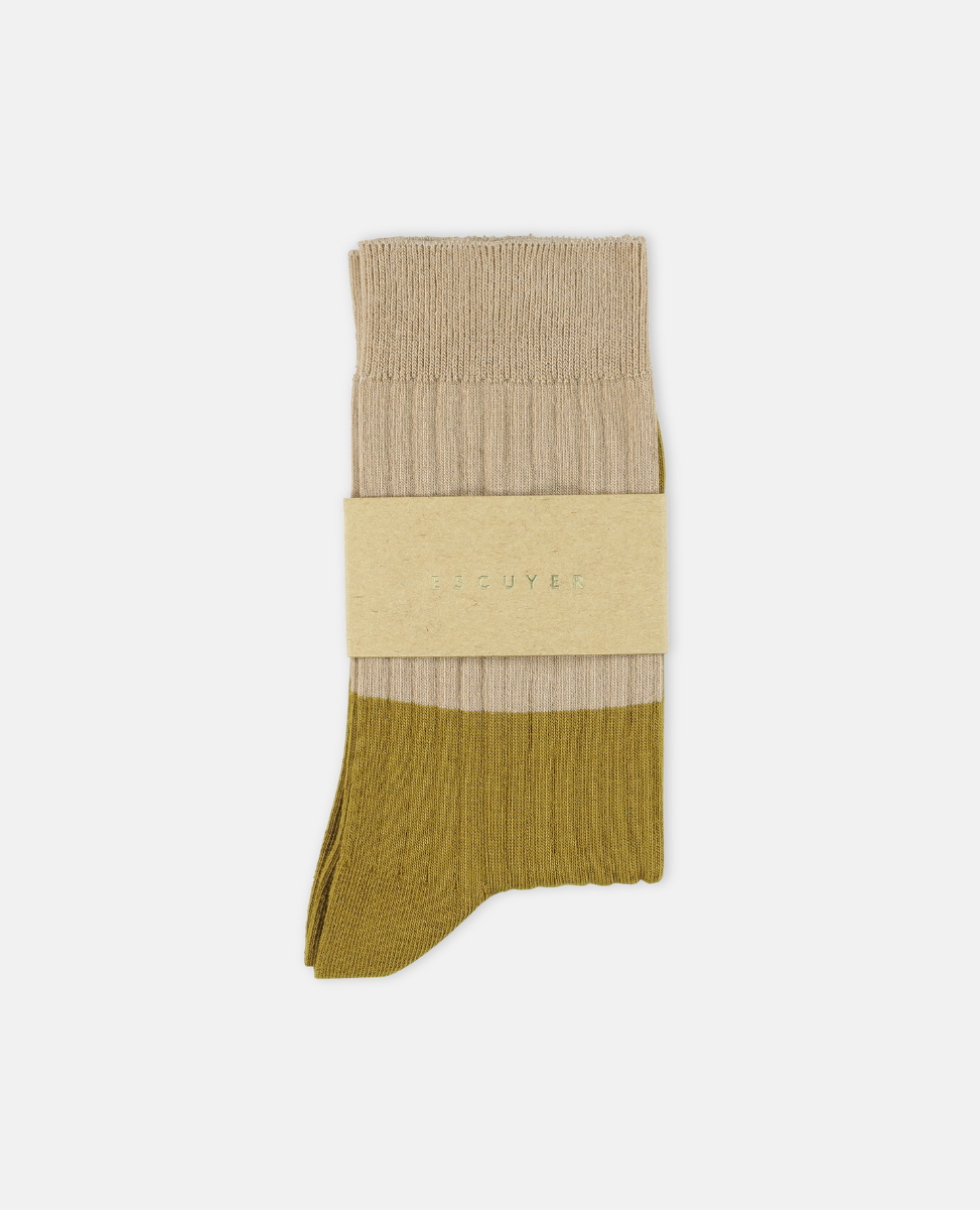 Escuyer Two-tone sock with beige top and green bottom on a white background