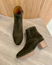 Third view of a clog ootie in split suede with a deep olive hue 3