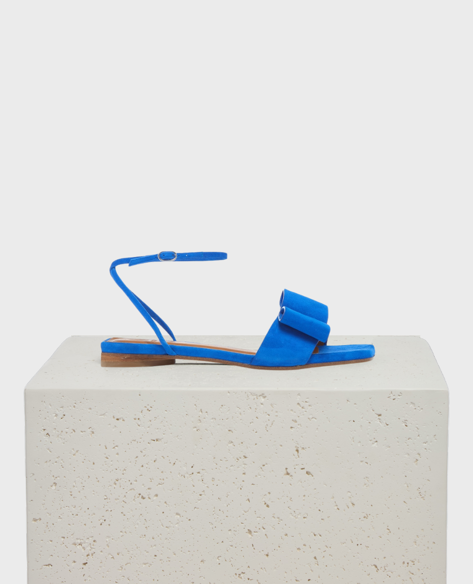 Blue suede sandal with bow and ankle strap