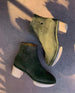 Side view of a clog bootie in split suede with a deep olive hue 2