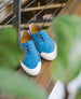 Wiew of Coclico Klara Sneaker obscured by leaves 7