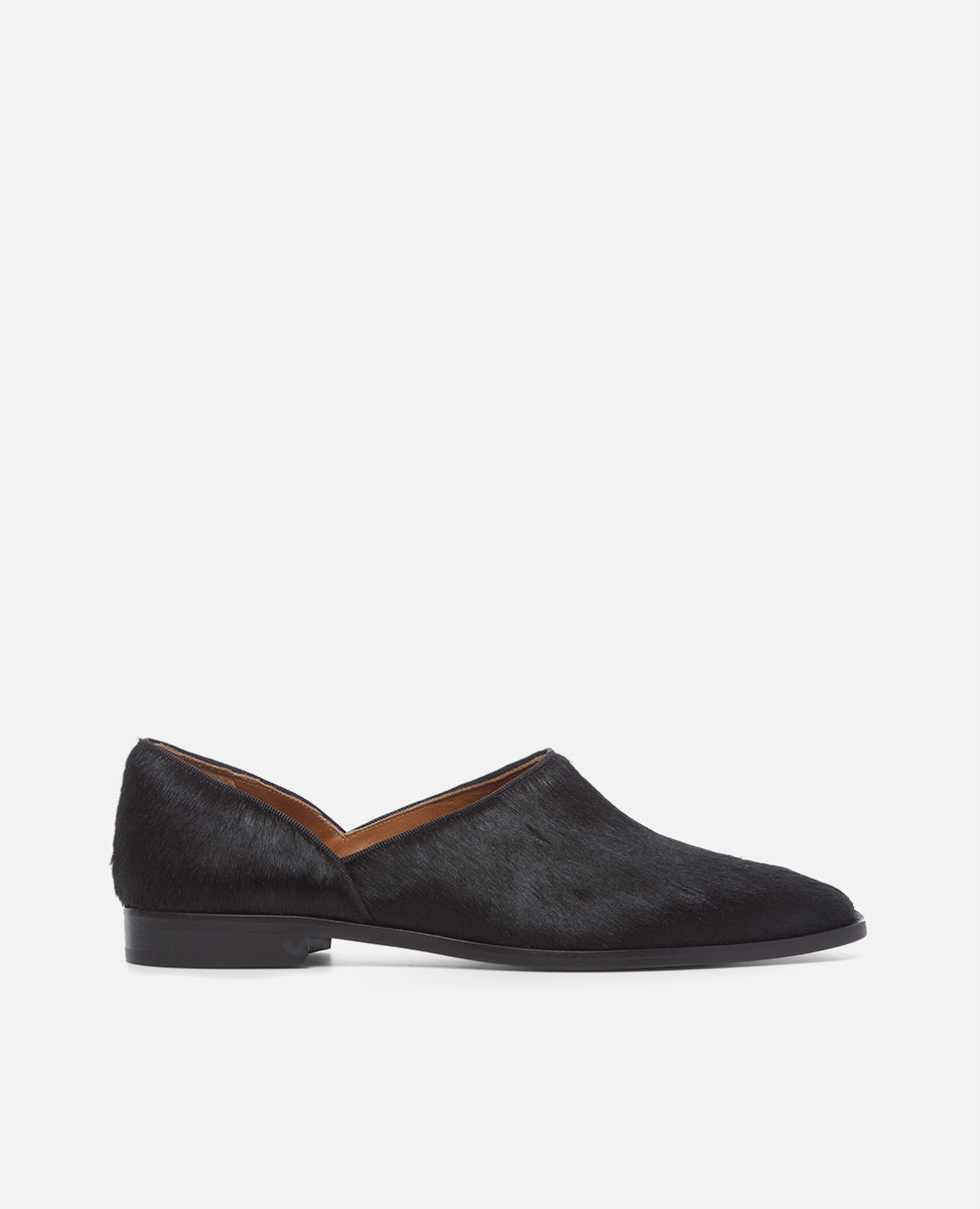 Black loafer shoe on a white background