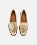 Pair of gold loafers on a white background 1