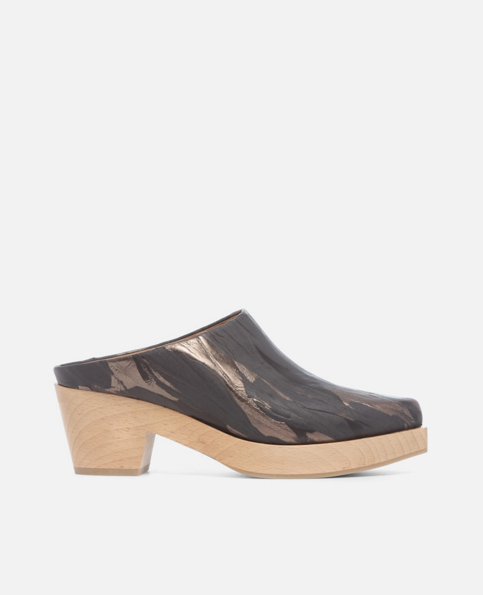 Black clog shoe with wooden sole on a white background