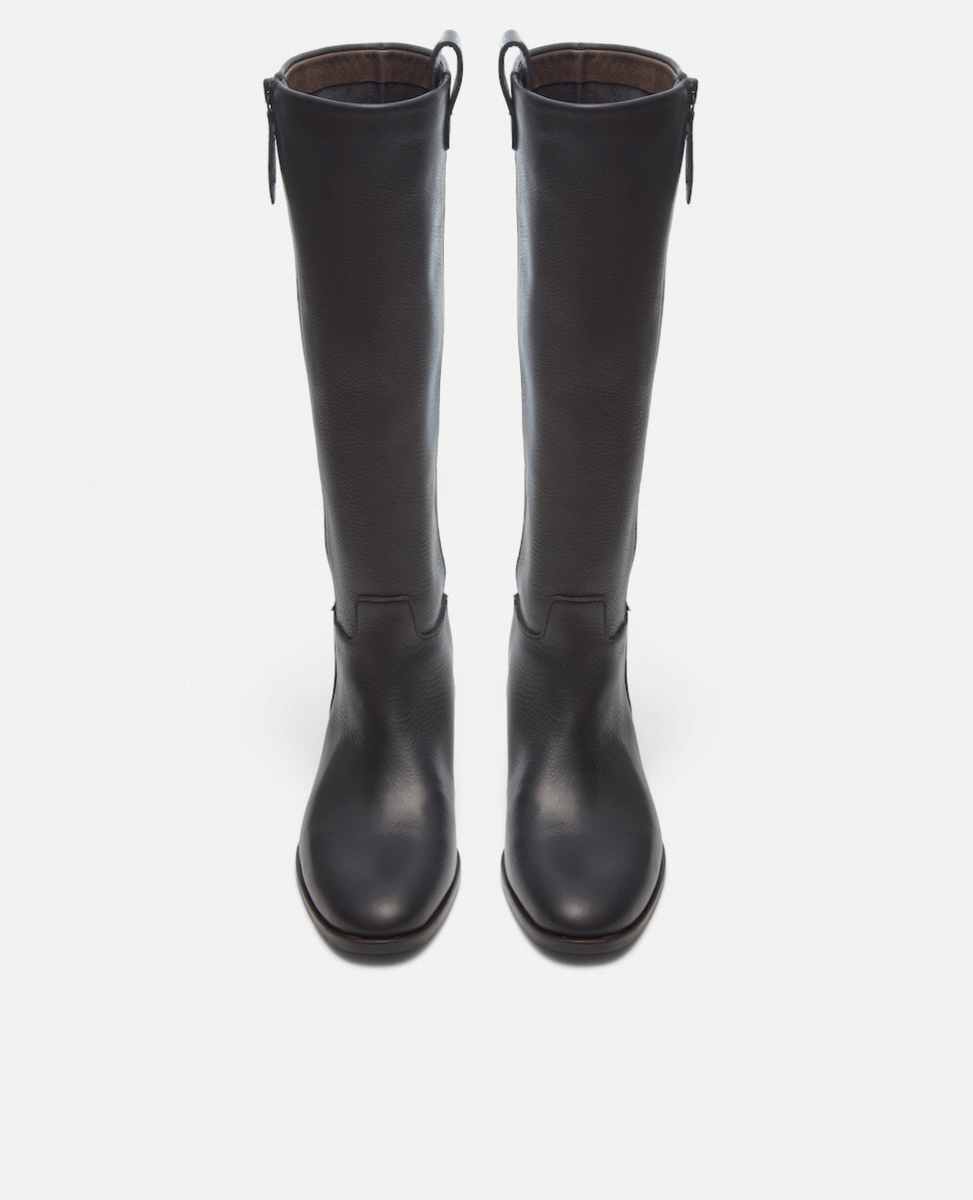 Pair of black knee-high boots on a white background