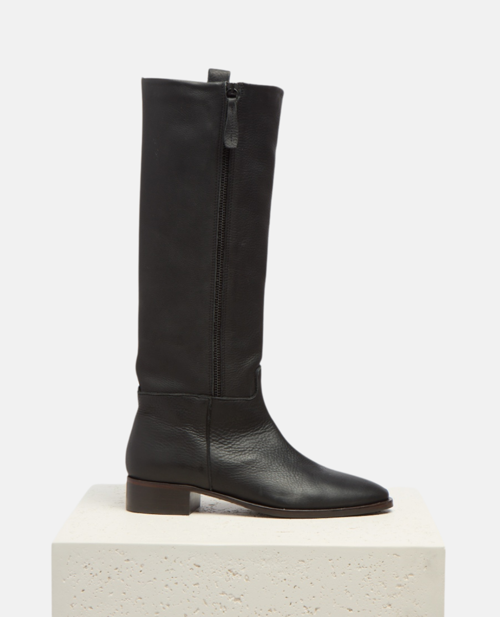 Black knee-high boot on a white background