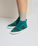 Teal suede high-top sneakers with white rubber soles, featuring wide black elastic bands across the top and a minimalist design. 3