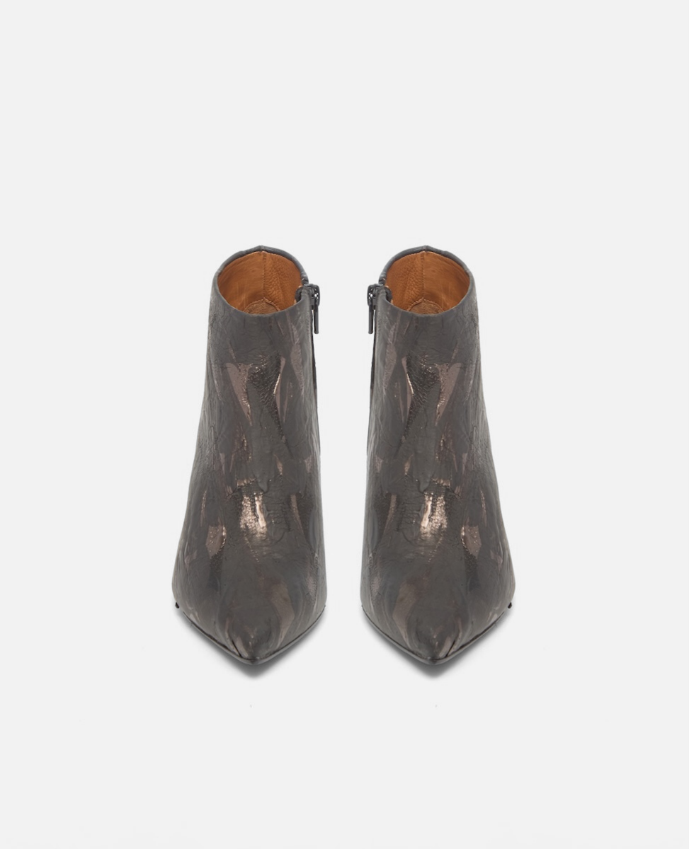 Pair of metallic brown ankle boots on a white background