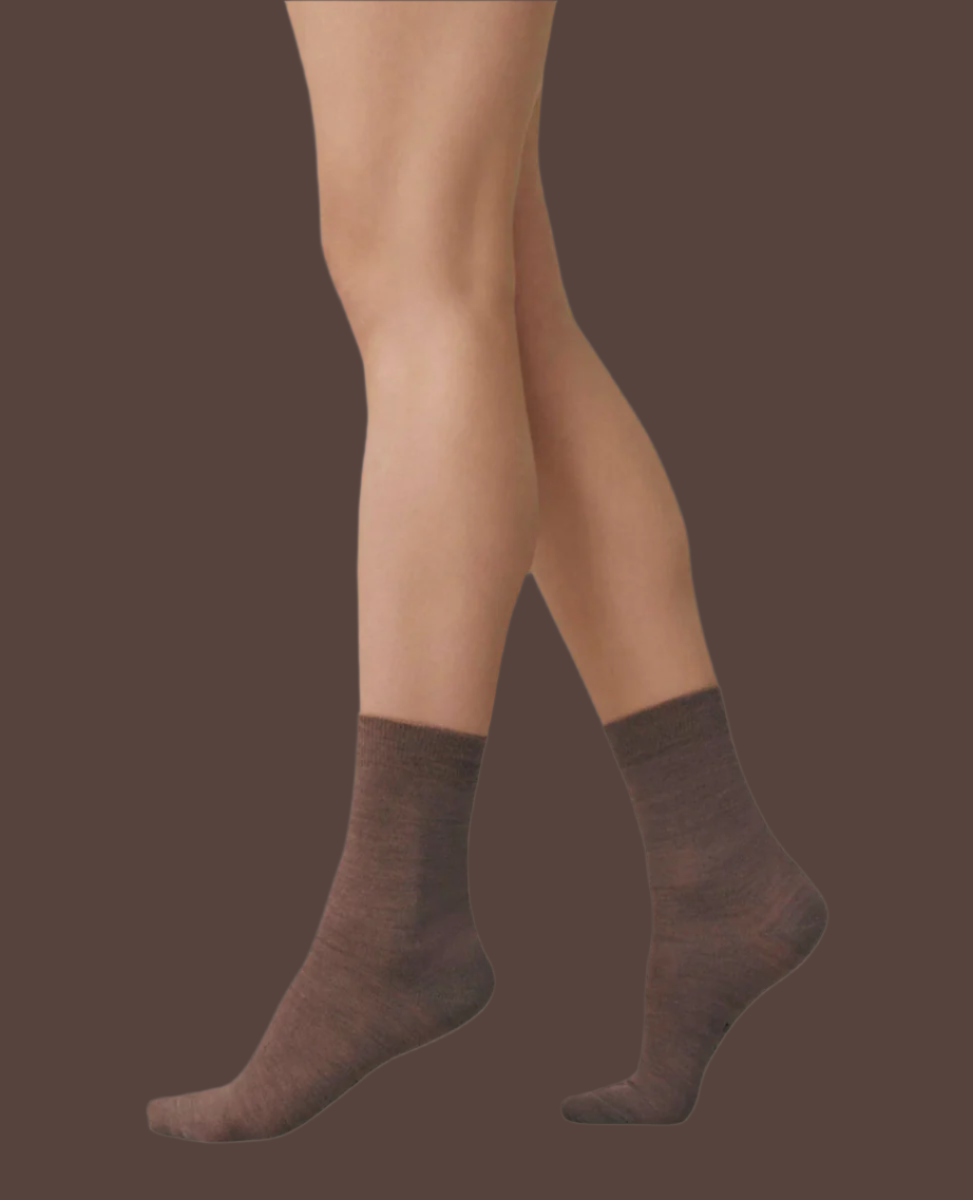 A pair of brown, mid-calf socks with a smooth texture, snug fit, and subtle ribbing at the top.