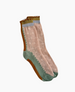 A pair of mid-calf socks featuring a pastel pink base with a textured polka dot pattern, accented by green and brown scalloped edges, and a light blue band at the top. 2