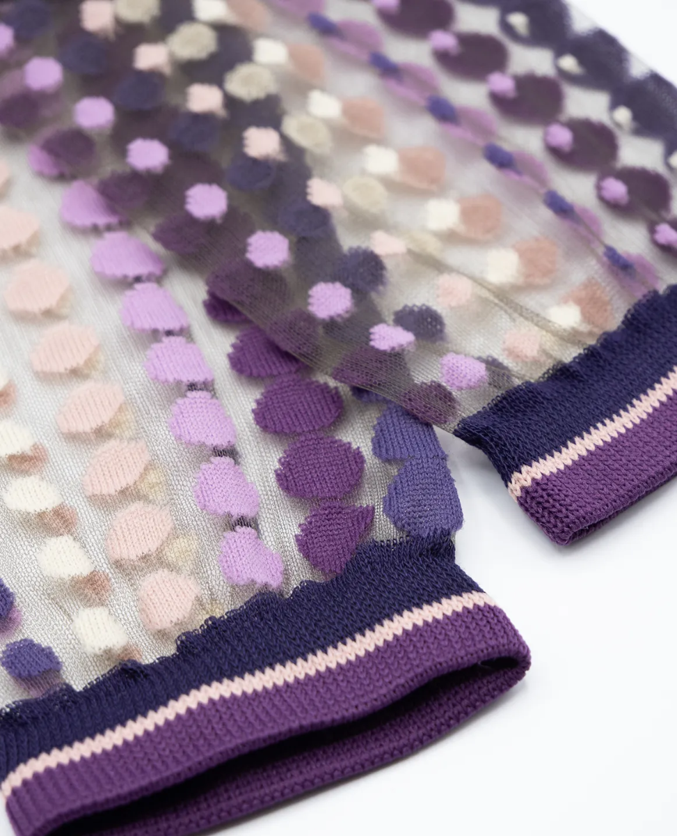 Purple gloves with textured pattern on a white background