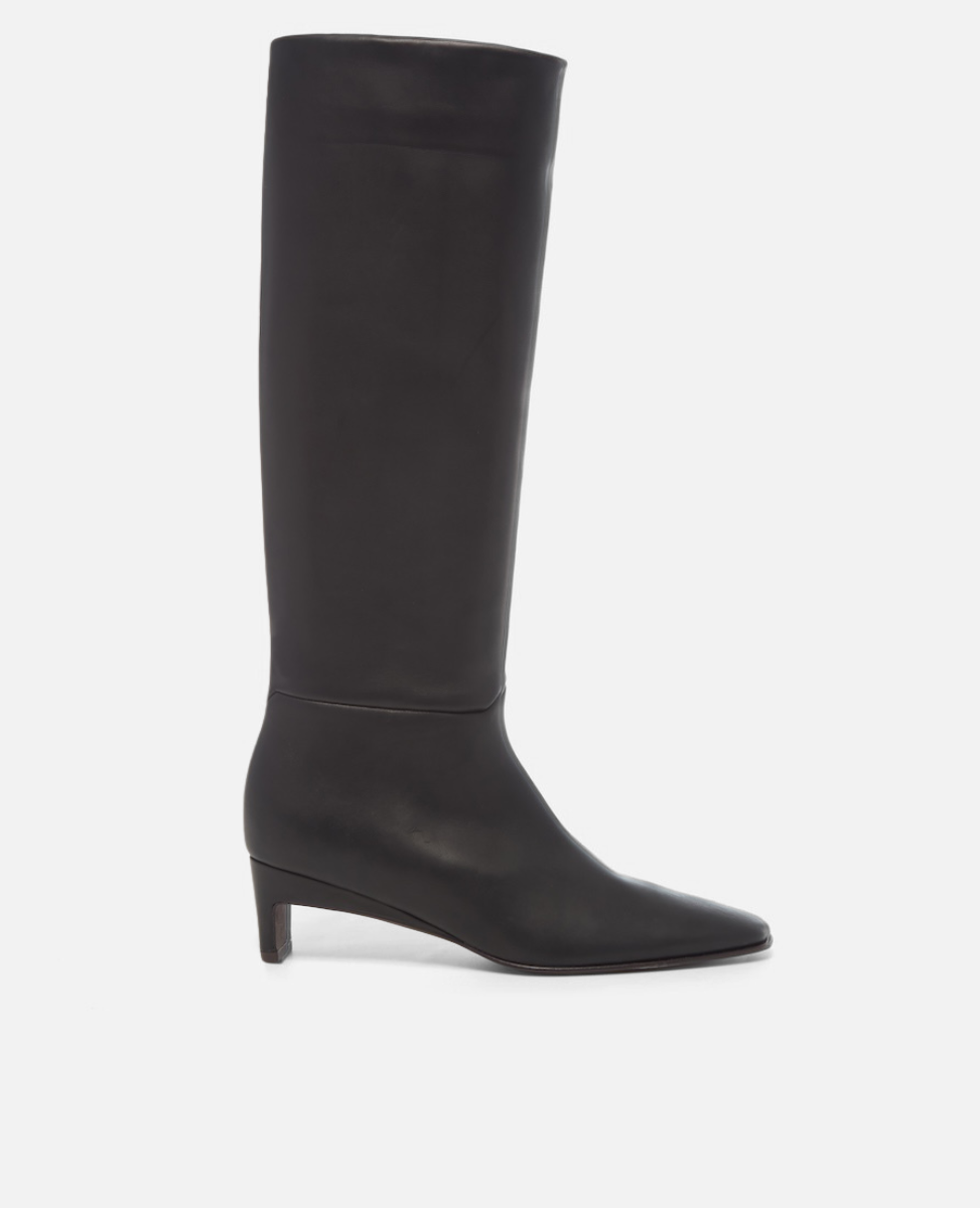 Black knee-high boot on a white background
