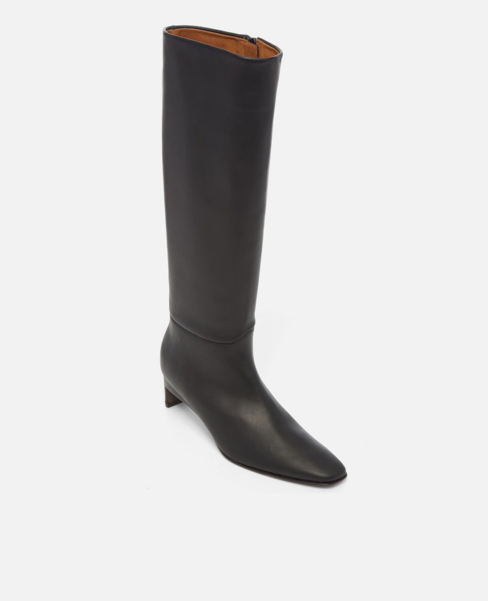 Black knee-high boot on a white background
