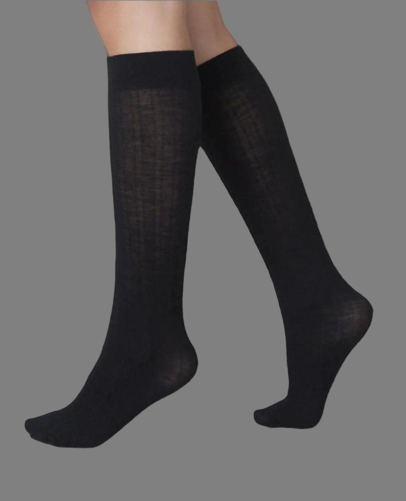 A pair of knee-high black socks with a smooth, slightly sheer texture and a snug fit around the calves.