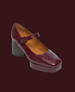 A maroon, square-toed, leather Mary Jane shoe with a chunky heel, an adjustable strap, and a smooth, polished finish. 4