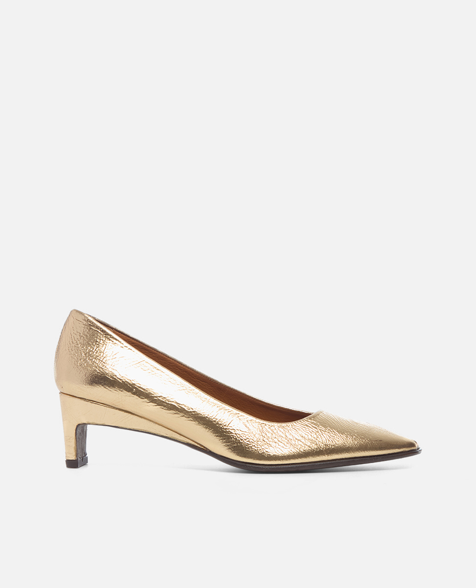 Gold high-heeled shoe on a white background