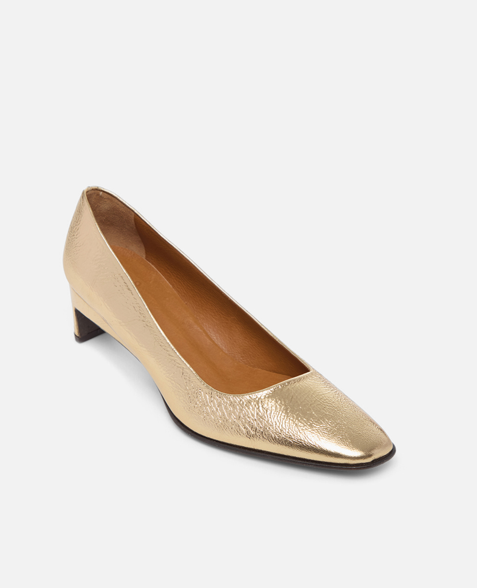 Gold high heel shoe on a white background
