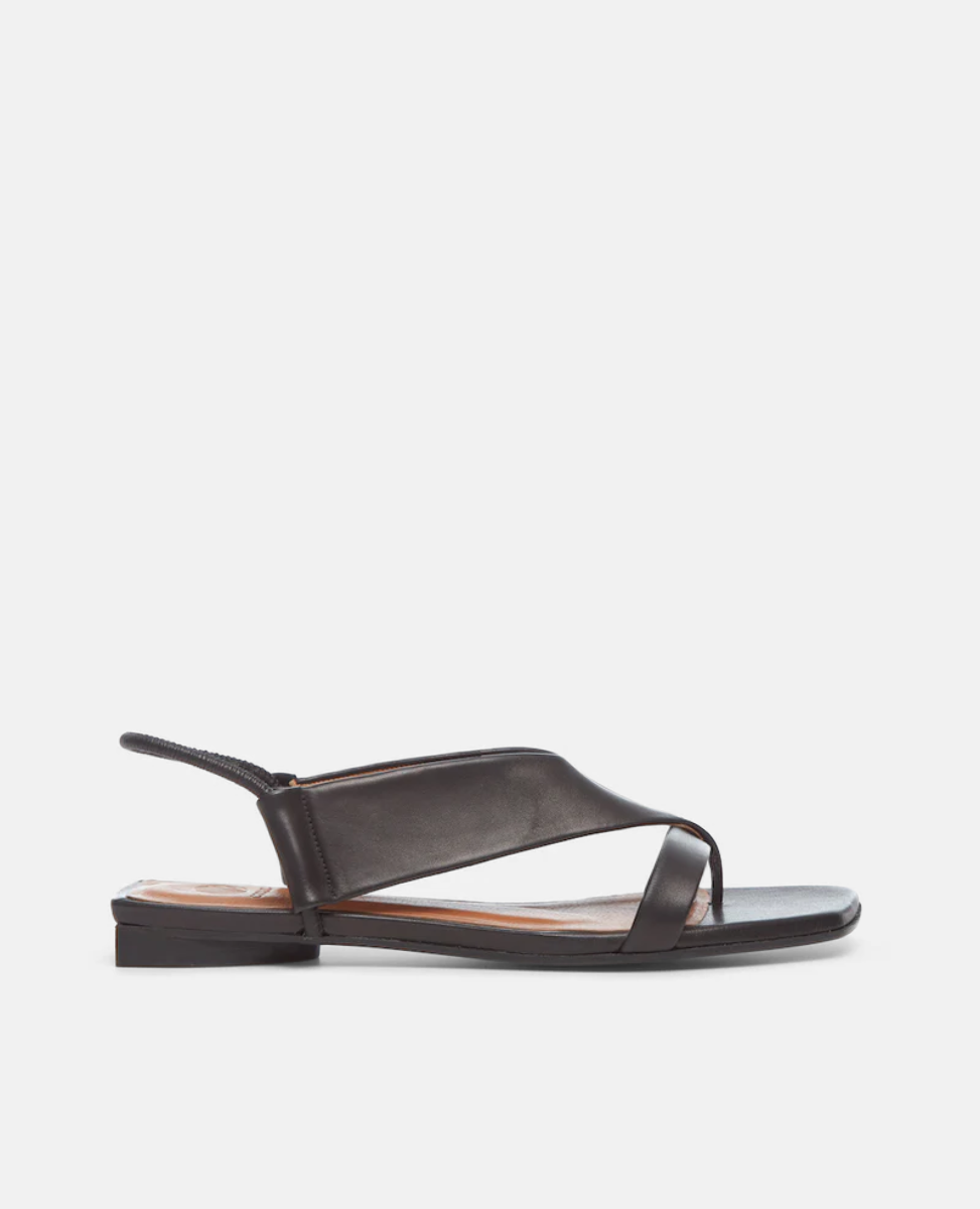 Side view of the Finch Sandal in Black, featuring a wide-strap thong and elasticized leather strap at the heel. 