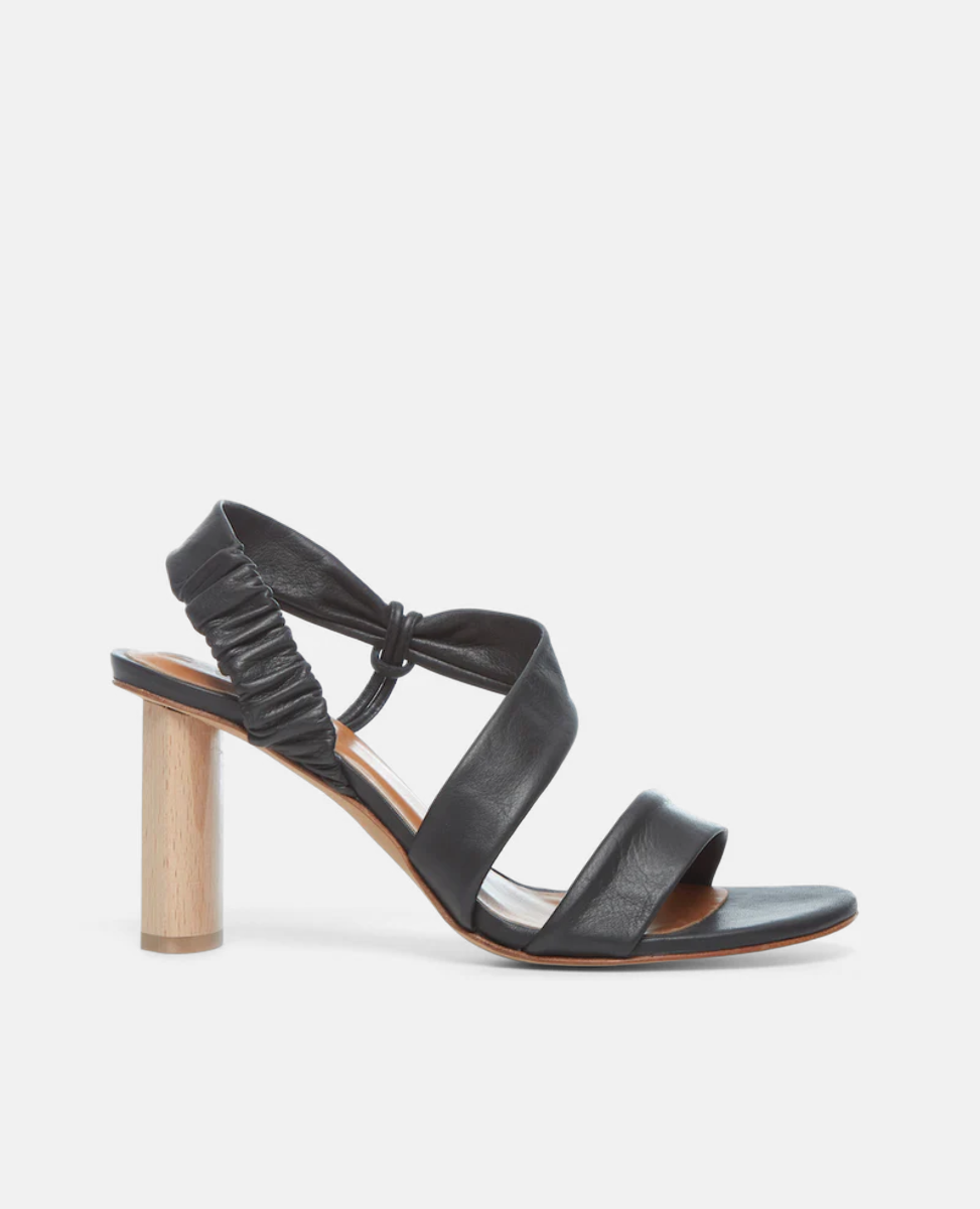 Side view of the Gabby Heel in Deep Sea, featuring soft, tubular straps that mold to the foot, one diagonally over the arch in a leg-lengthening magic trick.