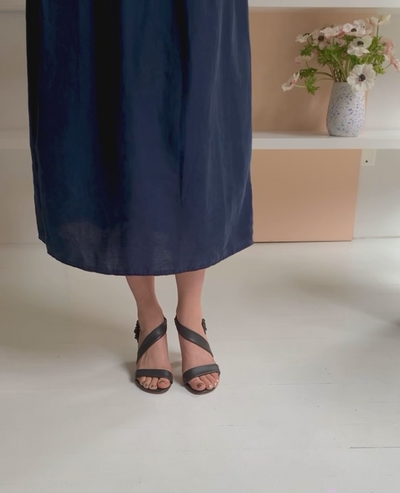 Woman walking in the Gabby Heel to show movement and fit.