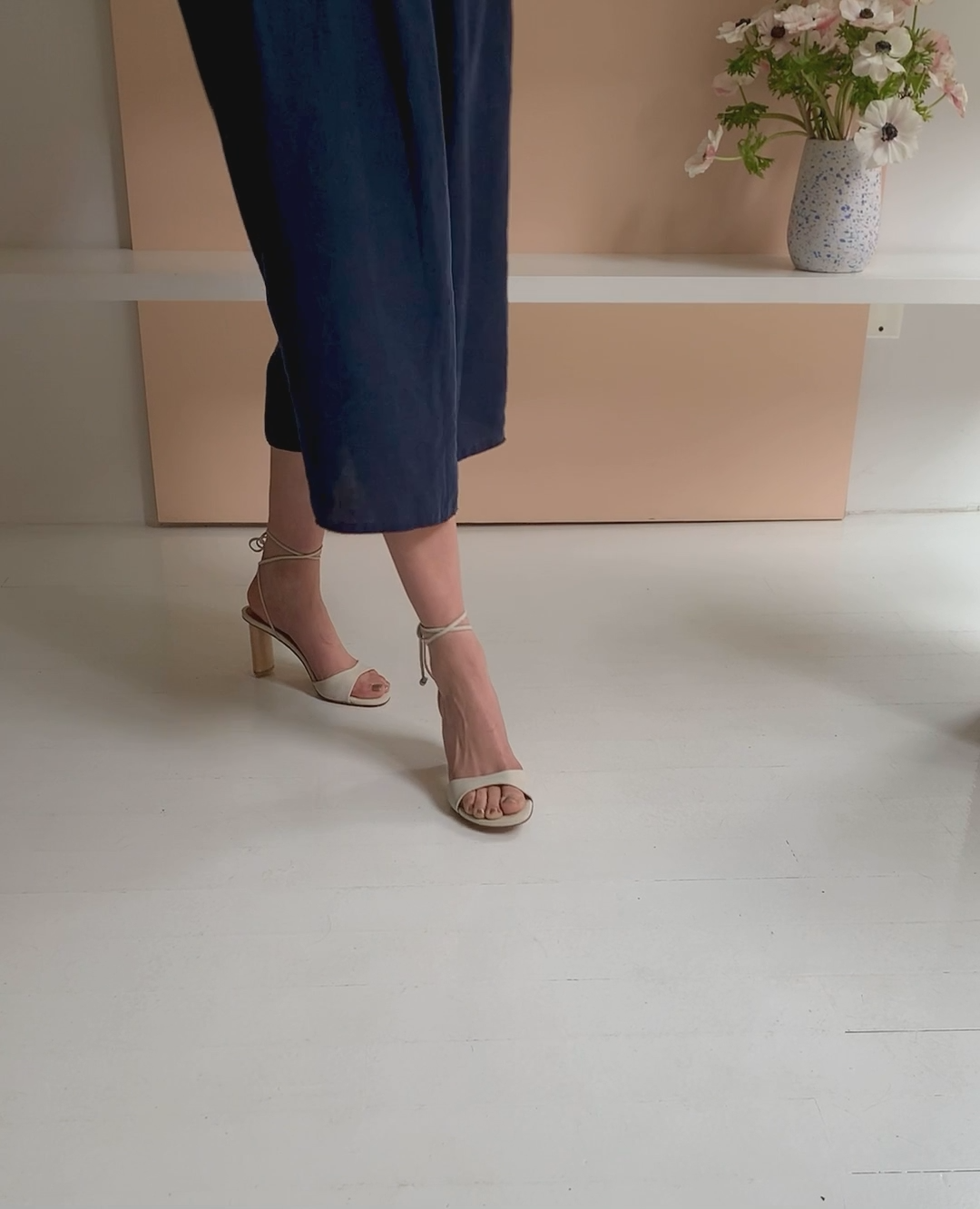 Woman walking in the Gilda Heel to show movement and fit.