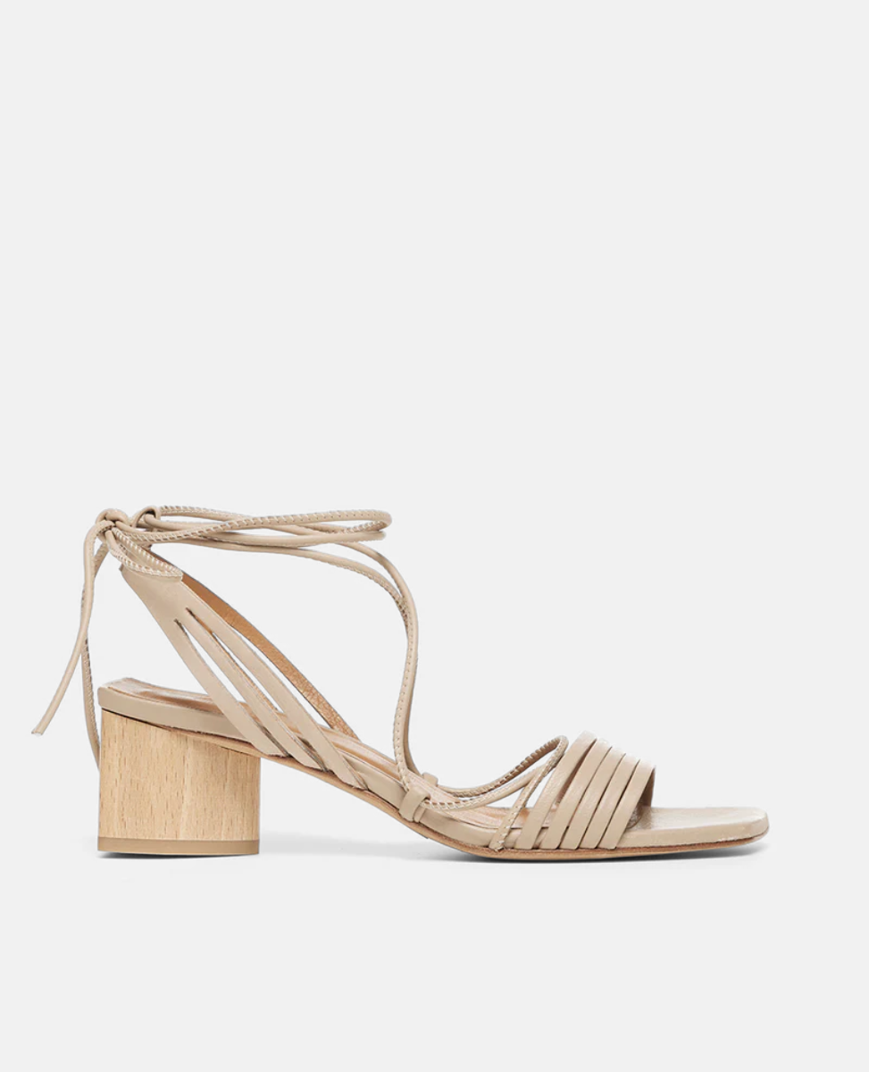 Coclico Solomiya Heel in Grey Mist leather a gladiator-style sandal, thin leather straps across vamp of foot, low-height solid-wood triangular heel - side view. 