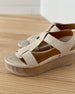 Angle view close up of Coclico Ally Clog in Greige leather: Open t-strap sandal on a wood wedge platform. Velcro closure. 6