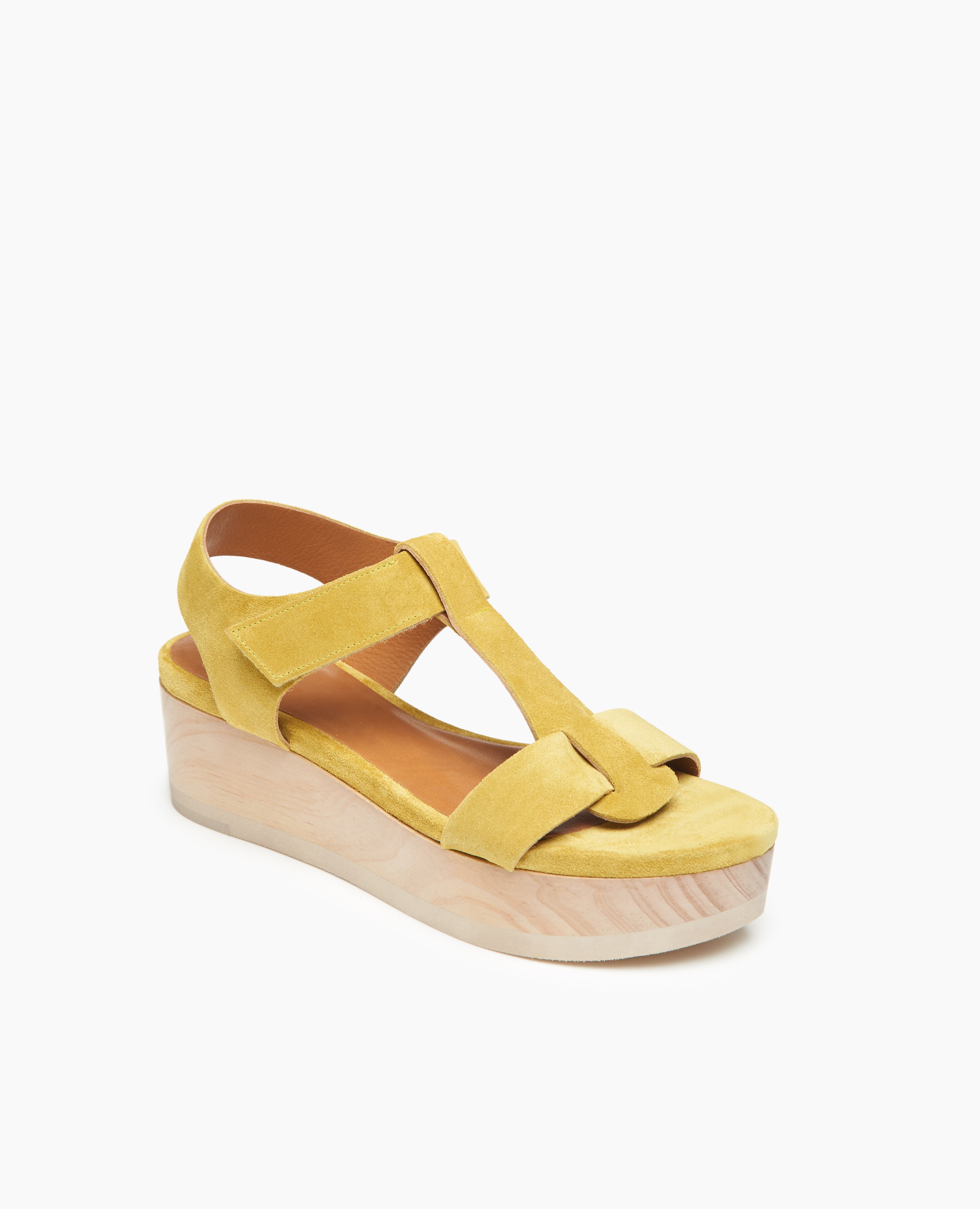 Coclico Ally Clog in Certosa suede, angled view: an open t-strap sandal on solid wood wedge platform with velcro closure.