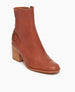 Coclico Babette Clog in Luggage leather, angled view: Side zip closure, block heeled bootie with half belt. 2