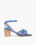 Side view of Coclico Babs Heel in Blu Estate leather: open sandal with 6 tubular straps across the foot, ankle strap, buckle closure, wood block mid-height heel. 1