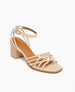 Coclico Babs Heel in Champagne shimmer suede, angled view: open sandal with 6 tubular straps across the foot, ankle strap, buckle closure, wood block mid-height heel. 2