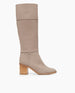 Side view of the Coclico Basil Boot in Limestone nubuck a tall boot with a mid-height wood block heel and inside zip closure.   1