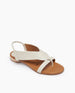 Coclico Cardinal Sandal in Greige leather, angled view: Flat thong style sandal with a V shape and a slim elastic heel strap. 4