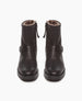 Damiana Shearling Boot displayed from the front. The full shearling lined modern moto boot is centered above, featuring a belt and loop at the ankle, a lug sole, and an inside-zip closure. 5