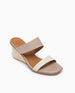 Coclico Doe Wedge in Greige & Marmo leather, angled view: Two-neutral-toned slide, asymmetric straps, solid wood mid-height wedge. 3