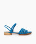 Side view of Coclico Emma Sandal in Blu Reale nubuck: open sandal with elasticated back strap, 5 padded straps across the foot, raised two-part wood and leather sole.  1