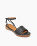 Coclico Erren Sandal in Deep Sea leather, angled view: open sandal with leather front band, raised two-part wood and leather sole, tubular ankle strap that crisscrosses behind the heel. 5
