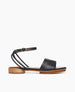 Side view of Coclico Erren Sandal in Deep Sea (almost black)  leather: open sandal with leather front band, tubular ankle strap that crisscrosses behind the heel, raised two-part wood and leather sole. 1