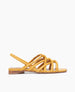 Side view of Coclico Falanda Sandal in Ambra leather: an open sandal with padded  tubular straps in a braided pattern across vamp of foot, elasticated slingback, flat feel. 1