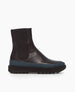 Side view of the France in Black leather: an easy pull-on chelsea boot with rubber midsole in teal, and toothed EVA out sole in black. 1