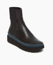 Angled view of the France in Black leather: an easy pull-on chelsea boot with rubber midsole in teal, and toothed EVA out sole in black. 2