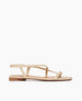 Side view of Coclico Frond Sandal in Champagne Shimmer suede: an open sandal with narrow asymmetric straps across foot, back strap, squared-off at the toe and heel. 1