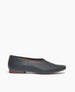 Coclico Haloumi Flat in Deep Sea leather: a slip-on, form-fitting flat in Italian certified sustainable leather with a squared-off toe and a 10mm solid wood heel - side view.   1