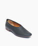 Coclico Haloumi Flat in Deep Sea leather, angle view: Slip-on, form-fitting flat in Italian certified sustainable leather with a squared-off toe and a 10mm solid wood heel.  2