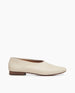Side view: Coclico Haloumi Flat in Greige leather: a slip-on, form-fitting flat in Italian certified sustainable leather with a squared-off toe and a 10mm solid wood heel.   1