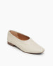 Coclico Haloumi Flat in Greige leather, angle view:  slip-on, form-fitting flat in Italian certified sustainable leather with a squared-off toe and a 10mm solid wood heel.   2