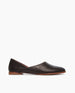 Side view of Coclico Henri Flat in Black leather: flat slide-on style with high-vamped scooped throat line, round toe. 1