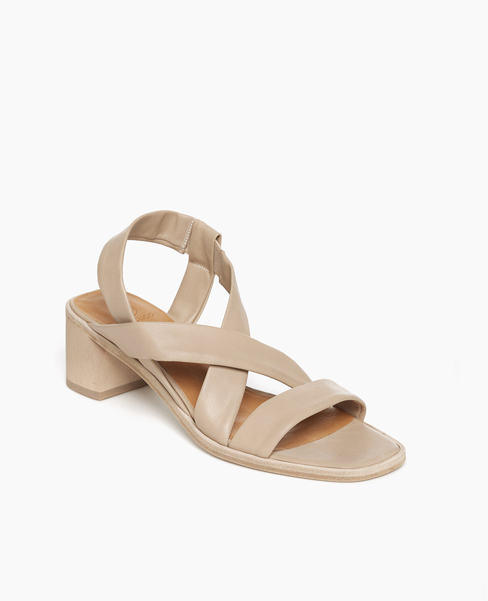 Coclico Jade Heel in Grey Mist leather, angled view: slip on sandal with soft leather tube straps across the foot, sling-back strap, wood block mid-height heel.